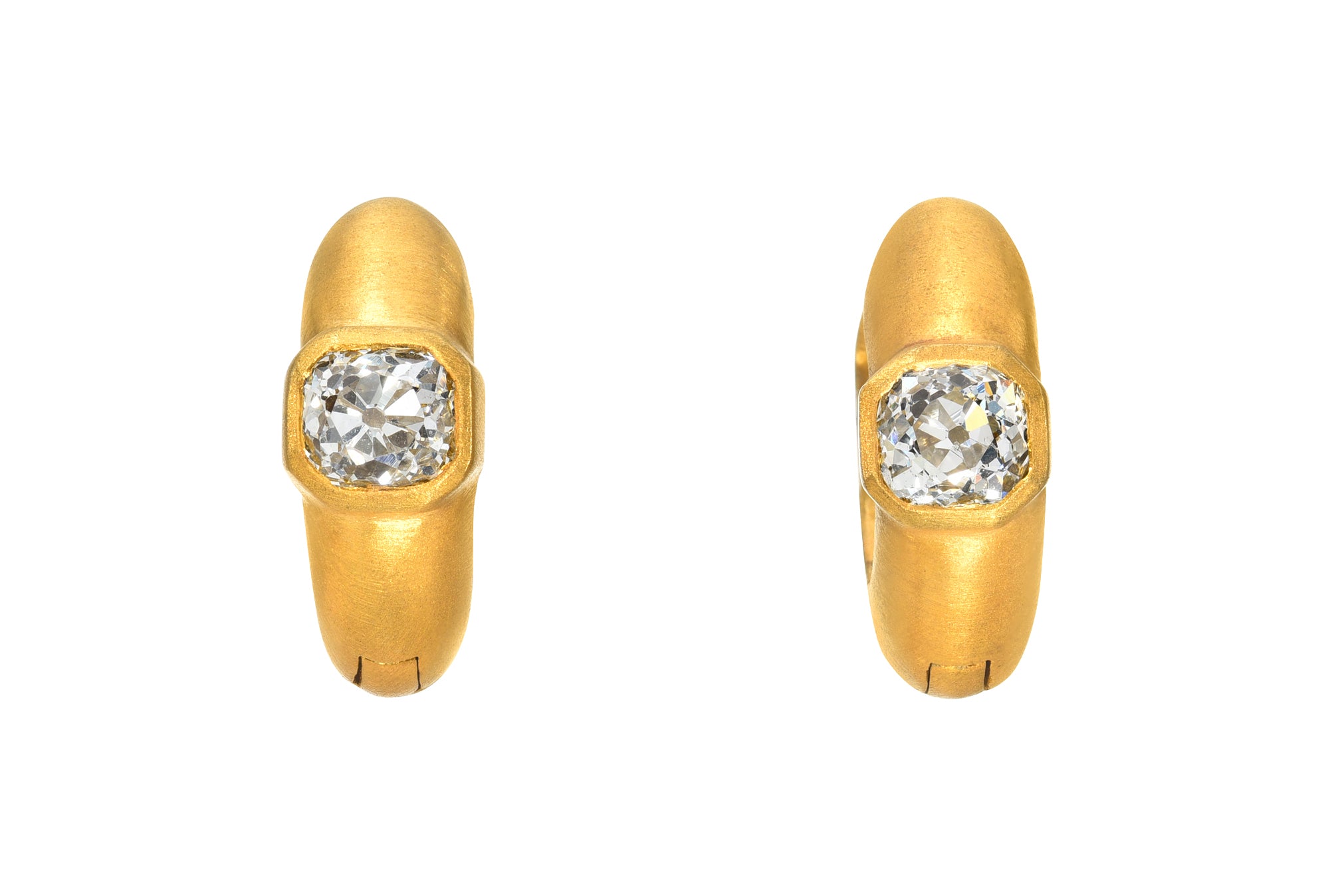 DARIUS JEWELS.Pair of Signature Hoops featuring 0.88 cts Antique Old Mine Cut Diamond bezel set in 18K Fairmined Yellow Gold.